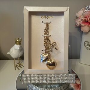 NIB! On 34th Gold-Tone Bag Charm With Hearts & Bow